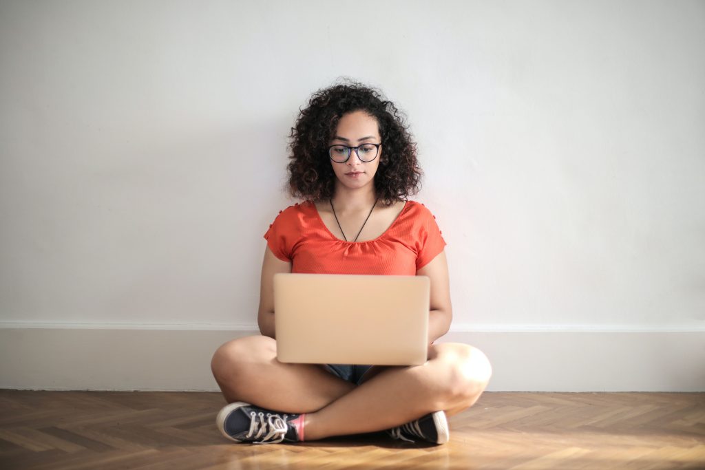 Programmer working on code at a laptop