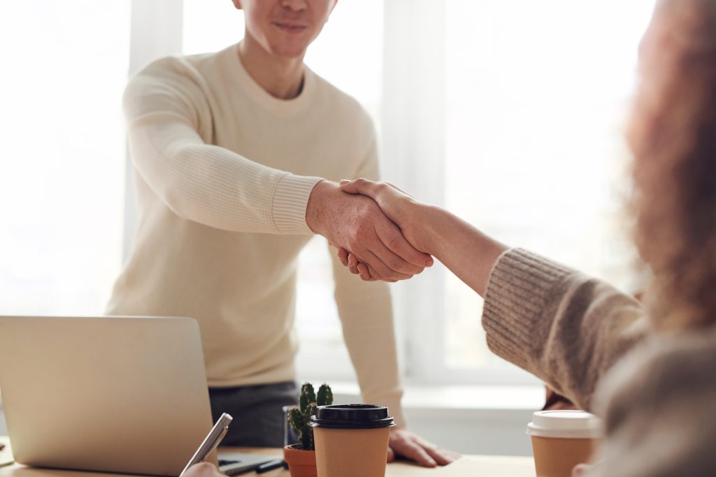 two people shake their hands